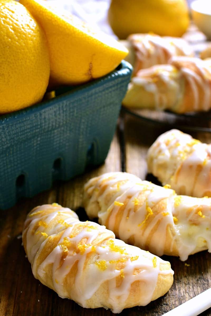 These Lemon Cheesecake Crescent Rolls are bursting with bright lemon flavor! Flaky crescent rolls filled with creamy lemon cheesecake and topped with a citrus glaze....they're the perfect addition to any brunch!