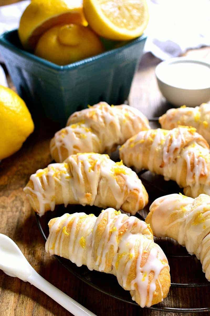 Lemon Cheesecake Crescent Rolls are bursting with bright lemon flavor! Flaky crescent rolls filled with creamy lemon cheesecake and topped with a citrus glaze....they're the perfect addition to any brunch!