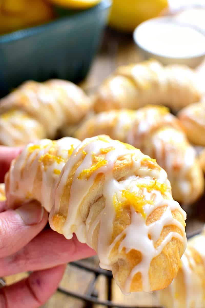 These Lemon Cheesecake Crescent Rolls are bursting with bright lemon flavor! Flaky crescent rolls filled with creamy lemon cheesecake and topped with a citrus glaze....they're the perfect addition to any brunch!