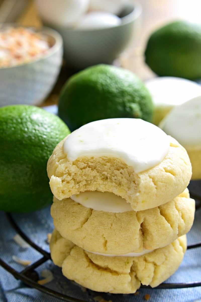 These Coconut Lime Sugar Cookies are a delicious taste of the tropics! Soft, pillowy sugar cookies flavored with coconut and lime zest, then topped with a sweet lime icing. Sure to become a new favorite!