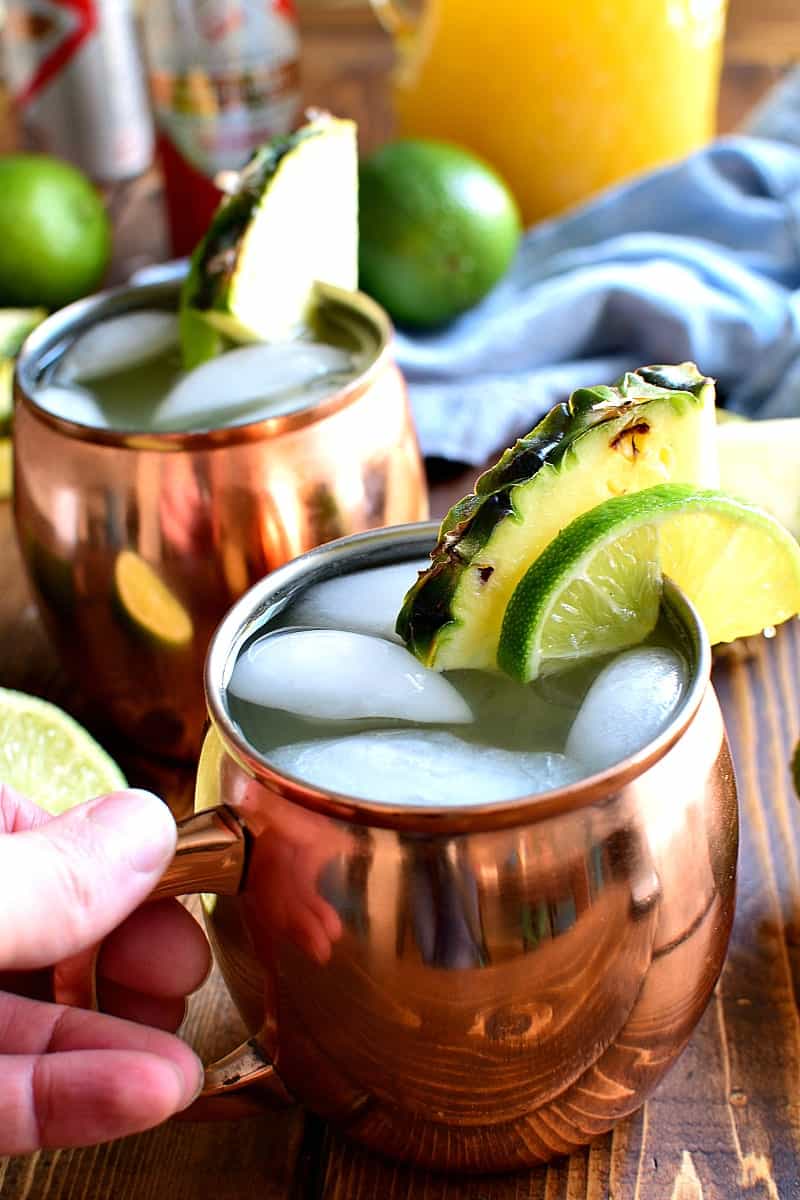 These Pineapple Moscow Mules are a delicious, refreshing twist on the original! Made with pure pineapple juice, fresh squeezed limes, ginger beer, and vodka, this is one cocktail you'll come back to again and again!