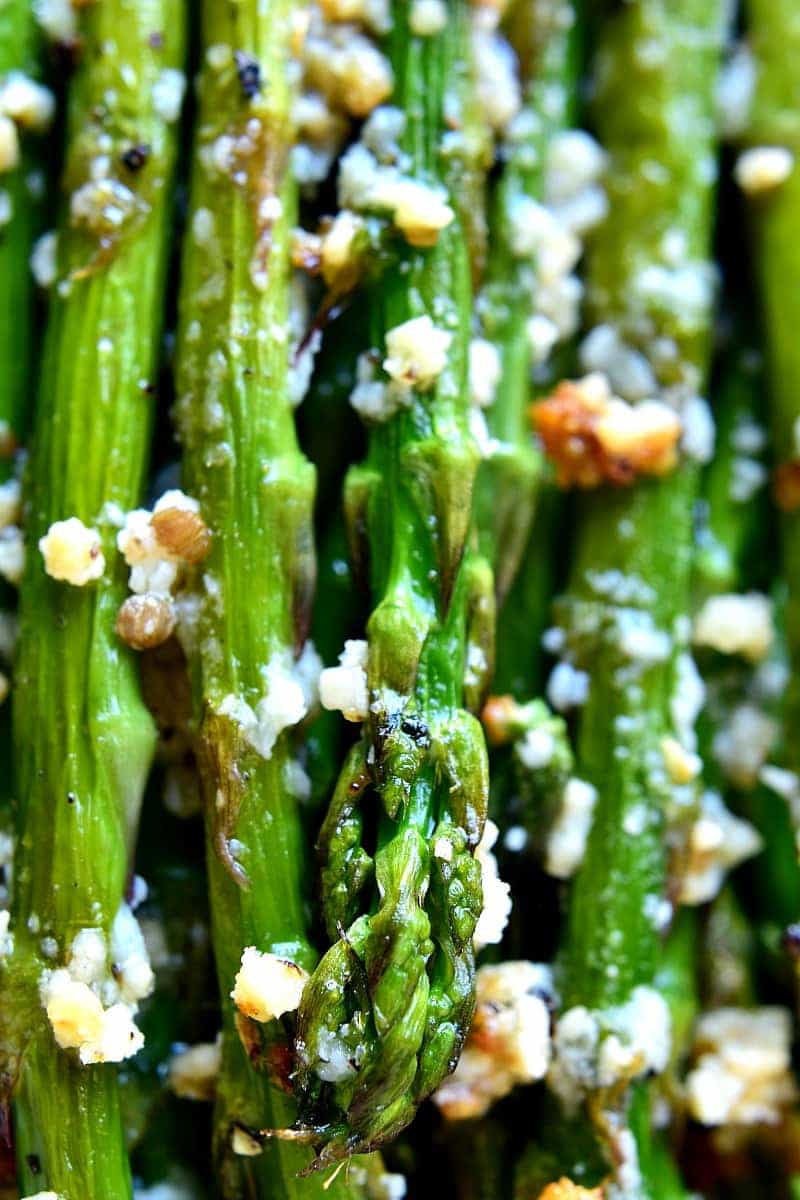 This Garlic Roasted Asparagus is packed with the delicious flavors of garlic and parmesan and is ready in 15 minutes or less! The perfect side dish for any meal....if you love garlic, this Garlic Roasted Asparagus is sure to become a favorite!