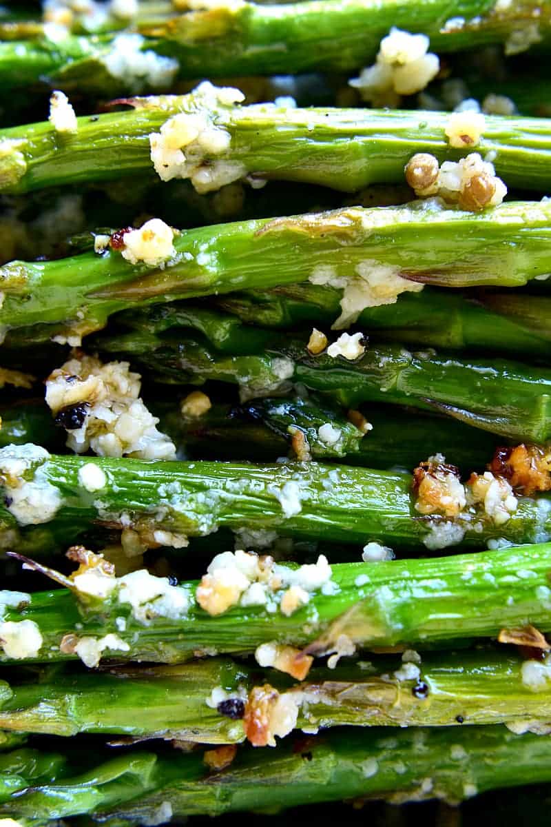 This Garlic Roasted Asparagus is packed with the delicious flavors of garlic and parmesan and is ready in 15 minutes or less! The perfect side dish for any meal....if you love garlic, this Garlic Roasted Asparagus is sure to become a favorite!