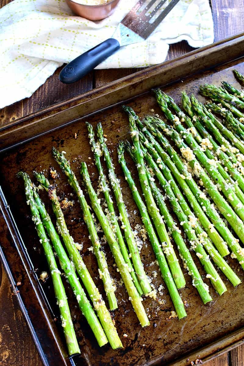 This Garlic Roasted Asparagus is packed with the delicious flavors of garlic and parmesan and is ready in 15 minutes or less! The perfect side dish for any meal....if you love garlic, this Garlic Roasted Asparagus is sure to become a favorite!