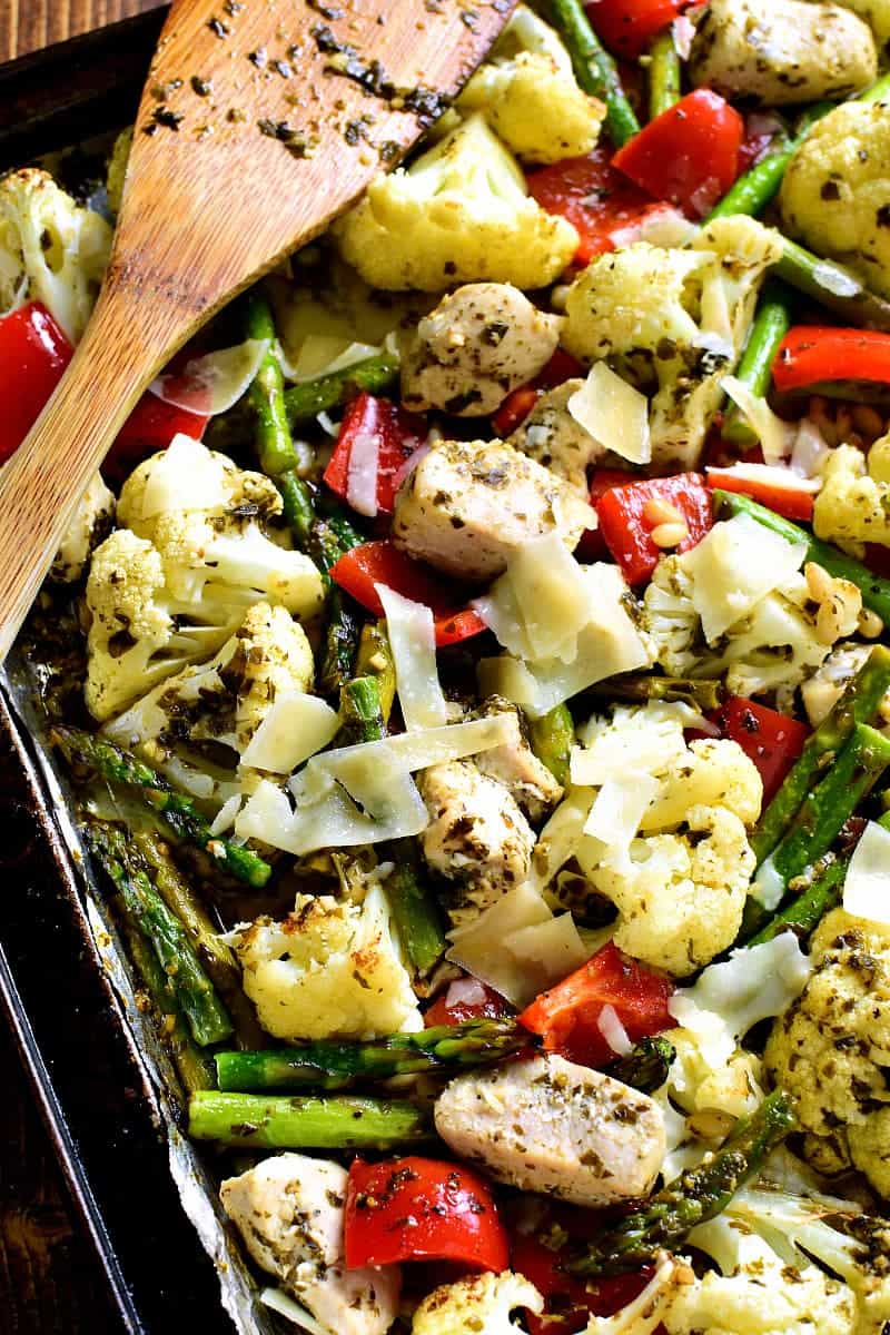 This Sheet Pan Pesto Chicken is loaded with veggies and packed with delicious flavor! Best of all, it requires just 10 minutes of prep and 20 minutes in the oven....all on just one pan!