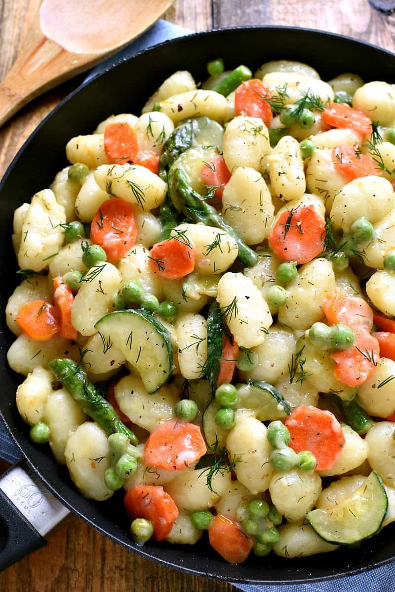 This Spring Vegetable Gnocchi is creamy, delicious, and comfort food at its finest. This gnocchi is loaded with fresh vegetables and comes together in under 20 minutes. 