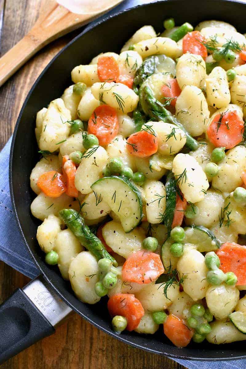 This Spring Vegetable Gnocchi is creamy, delicious, and comfort food at its finest. This gnocchi is loaded with fresh vegetables and comes together in under 20 minutes. 