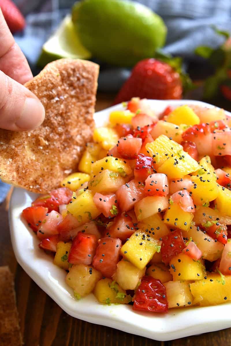 tortilla chip dipping into the BEST Fruit Salsa