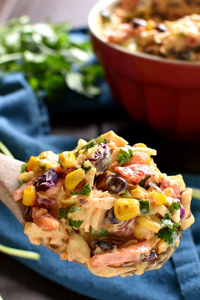 Taco Salad meets coleslaw in this deliciously creamy Mexican Coleslaw! Packed with flavor and perfect for summer cookouts!