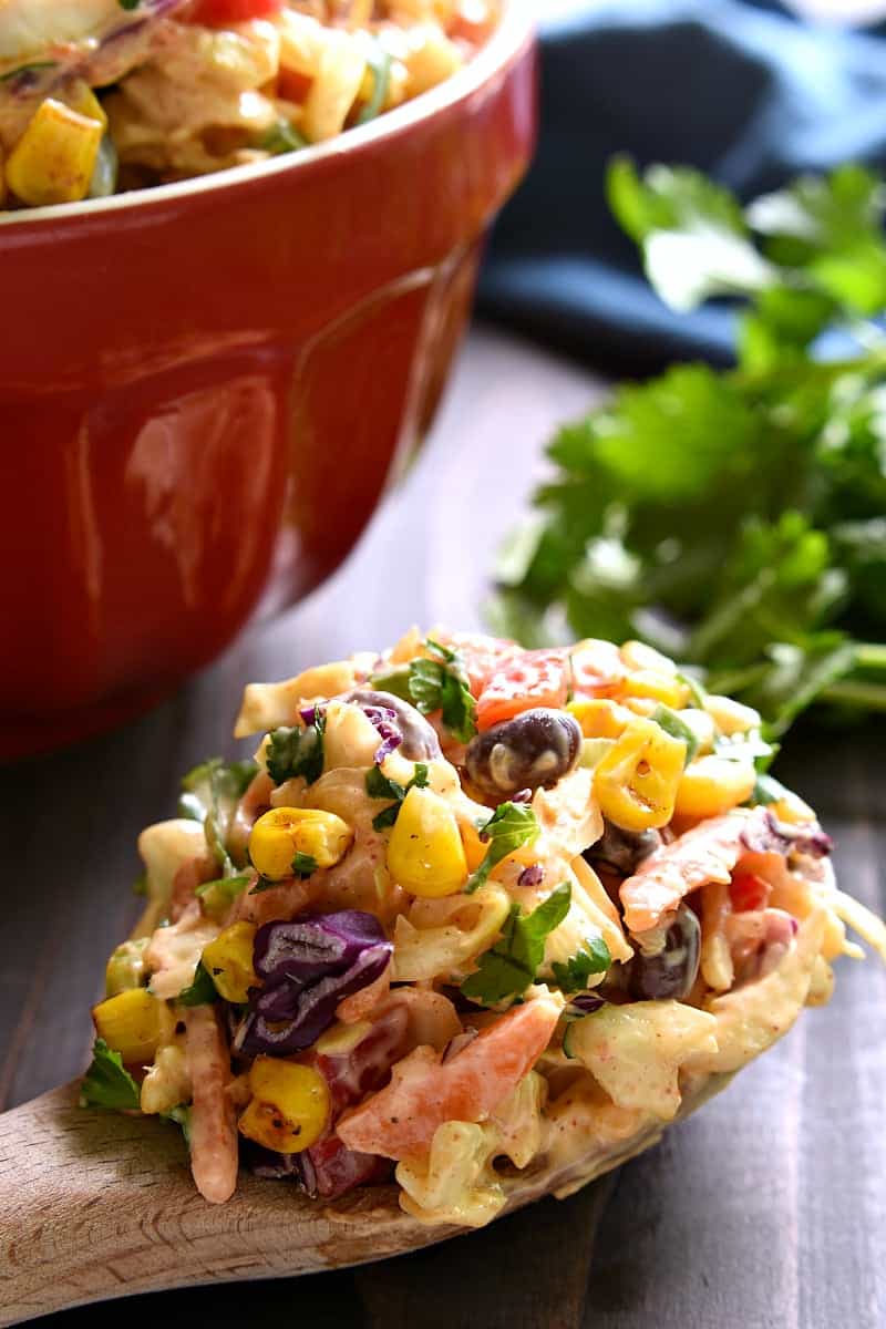 Taco Salad meets coleslaw in this deliciously creamy Mexican Coleslaw! Packed with flavor and perfect for summer cookouts!