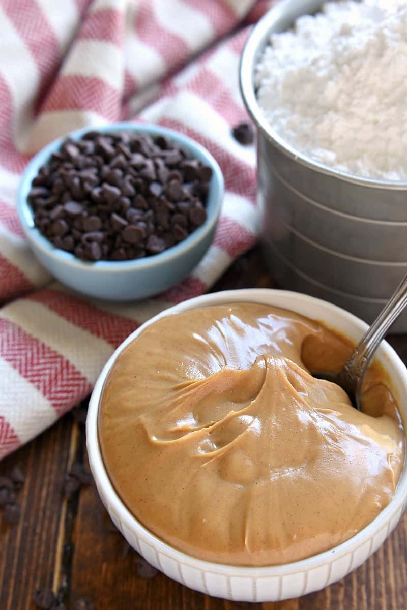 white bowls - one with creamy peanut butter and the other with chocolate chips