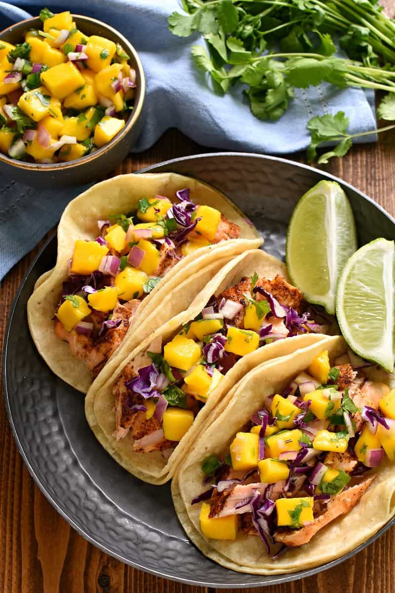 Plate with 3 Fish Tacos topped with tropical mango salsa