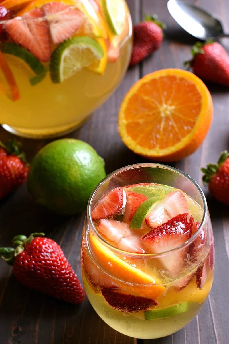 overhead image of a glass and pitch of summer fruit sangria