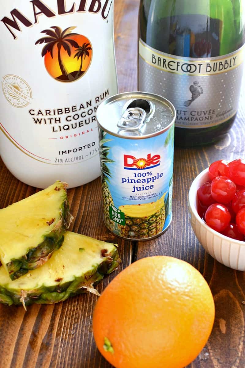 ingredients needed to make Tropical Mimosas - Malibu rum, pineapple juice, and champagne