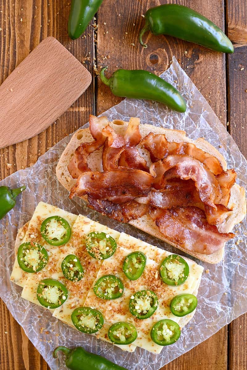 This Jalapeño Popper Grilled Cheese is EVERYTHING!! Gooey, spicy, cheesy, and SO delicious. If you love jalapeño poppers you'll go crazy for this awesome sandwich!