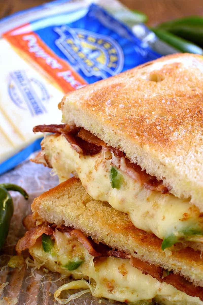 This Jalapeño Popper Grilled Cheese is EVERYTHING!! Gooey, spicy, cheesy, and SO delicious. If you love jalapeño poppers you'll go crazy for this awesome sandwich!