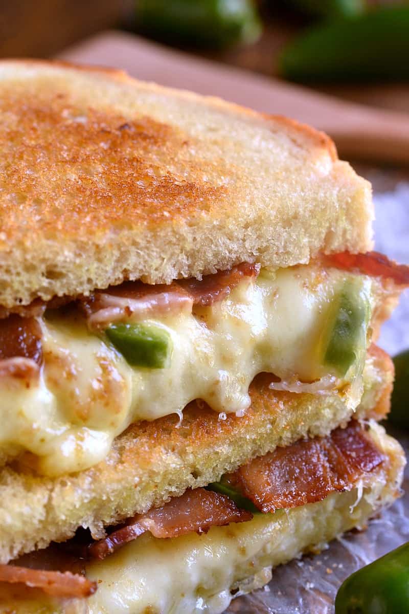 This Jalapeño Popper Grilled Cheese is EVERYTHING!! Gooey, spicy, cheesy, and SO delicious. If you love jalapeño poppers you'll go crazy for this awesome sandwich!