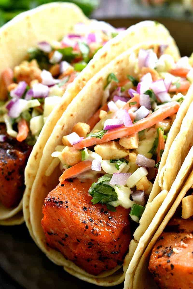 If you love salmon, you'll adore these Sriracha Salmon Tacos! They're topped with a simple Cilantro Lime Cole Slaw for the perfect balance of spicy and sweet. The BEST way to mix things up on taco night!