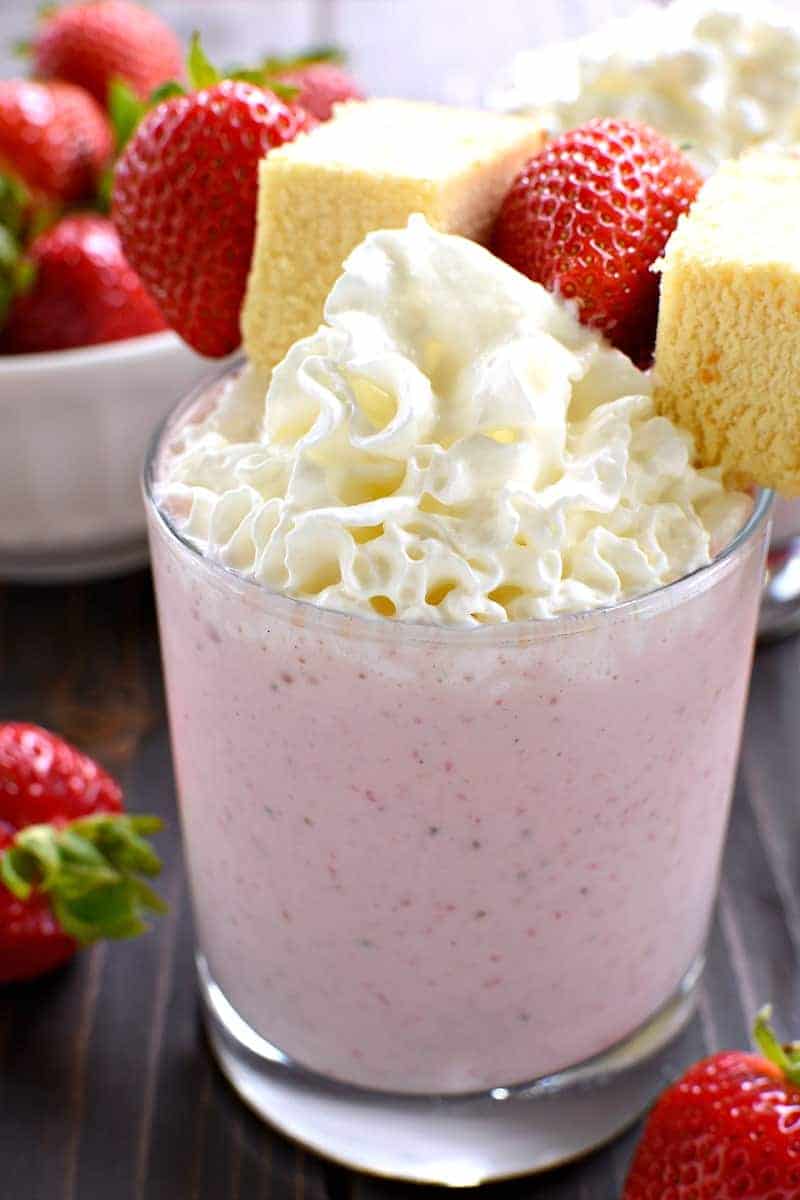 This Strawberry Shortcake Milkshake is the perfect summer treat! All the flavors of strawberry shortcake in one delicious glass....and ready in no time at all! If you love shortcake you'll LOVE this easy summer twist!