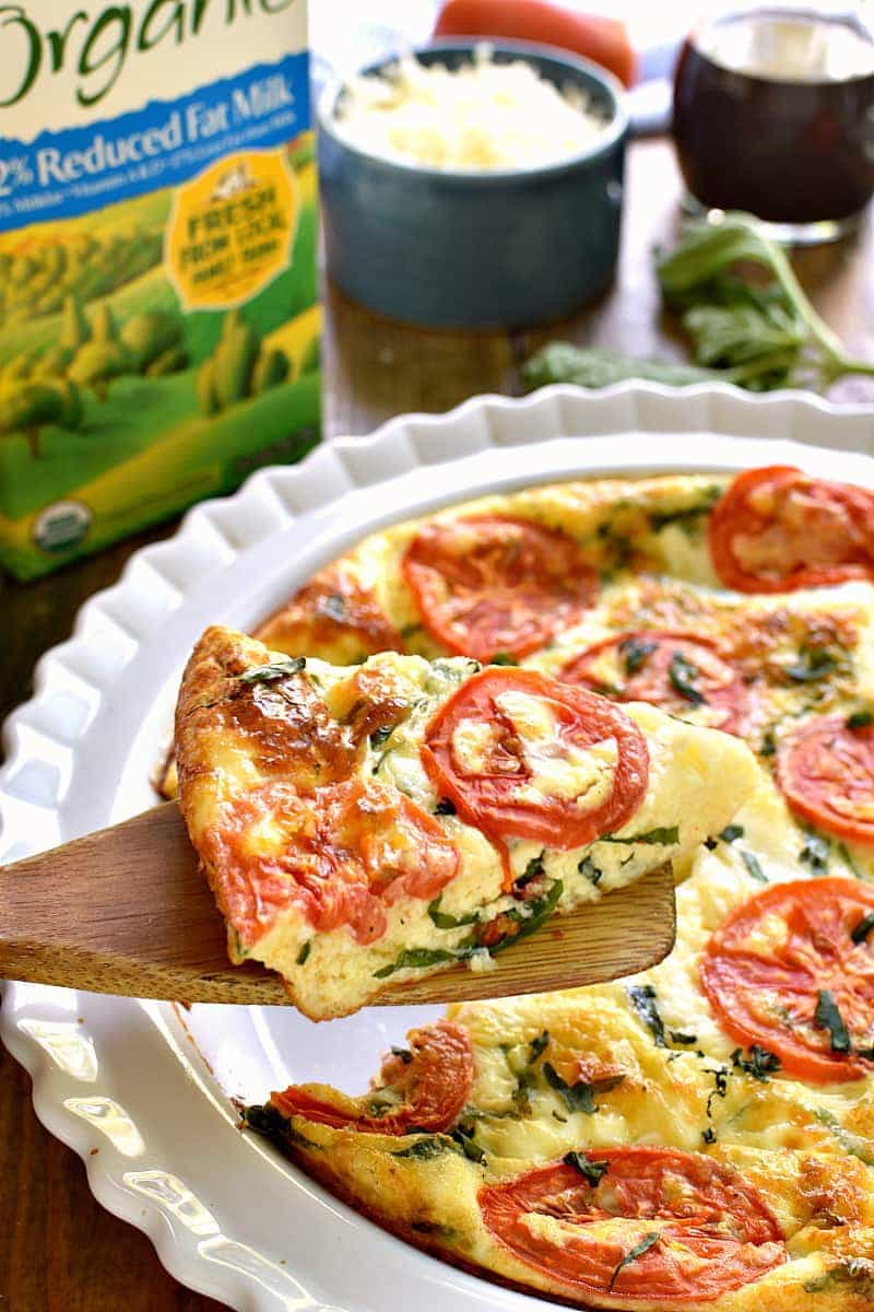 This Caprese Quiche is the ultimate summer breakfast! Loaded with fresh tomatoes, basil, and mozzarella cheese, it comes together quickly and is perfect for breakfast, lunch, or even dinner!