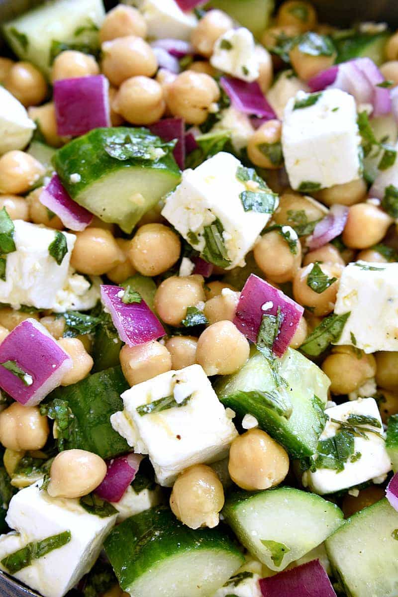 This Chickpea Cucumber Feta Salad has ALL the best flavors! Loaded with chickpeas, cucumbers, red onions, feta cheese, and fresh basil....this salad is so easy to make and is the perfect side dish for any meal!