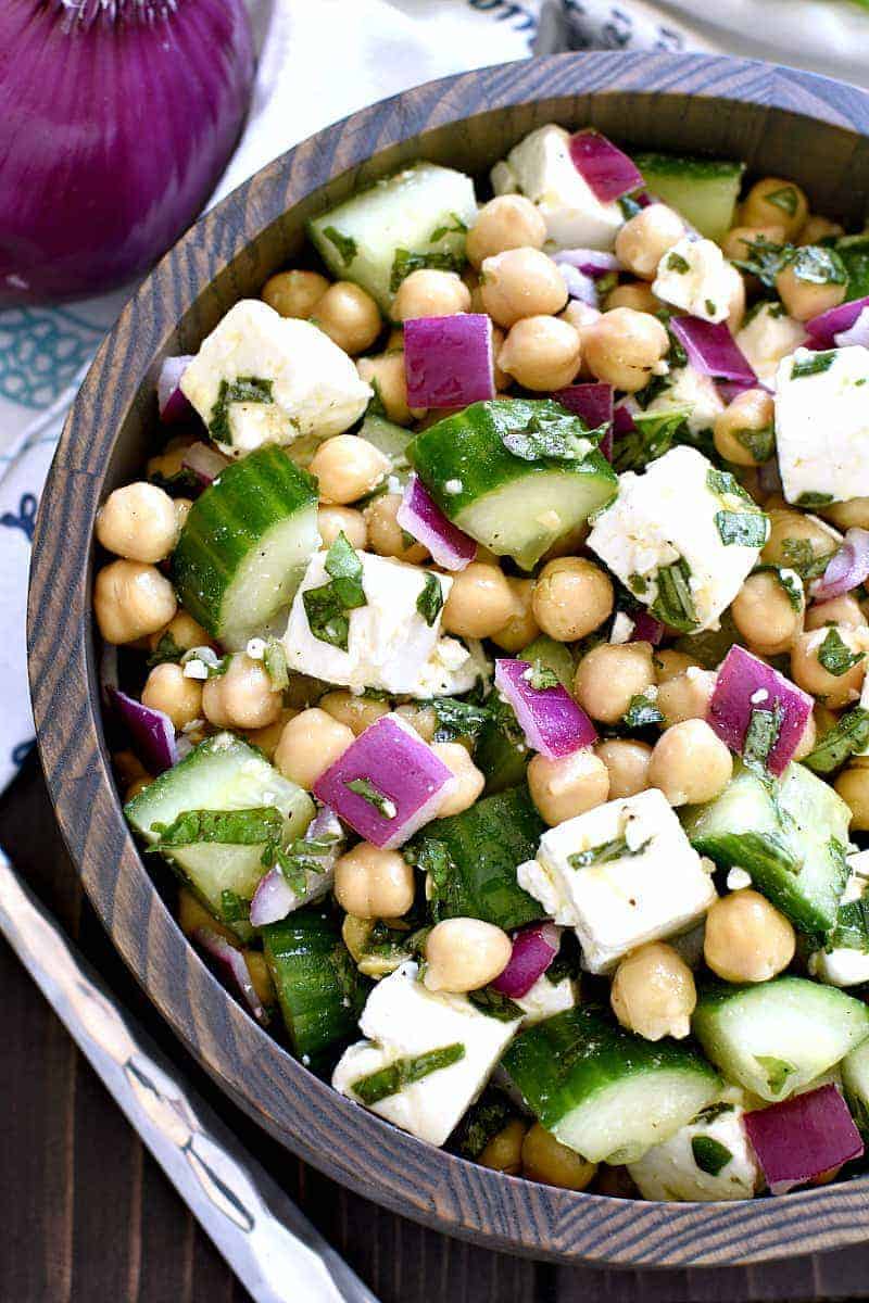 This Chickpea Cucumber Feta Salad has ALL the best flavors! Loaded with chickpeas, cucumbers, red onions, feta cheese, and fresh basil....this salad is so easy to make and is the perfect side dish for any meal!