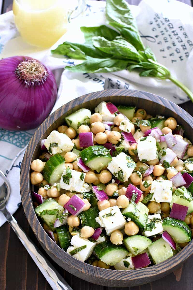 This Chickpea Cucumber Feta Salad has ALL the best flavors! Loaded with chickpeas, cucumbers, red onions, feta cheese, and fresh basil....this salad is so easy to make and is the perfect side dish for any meal!