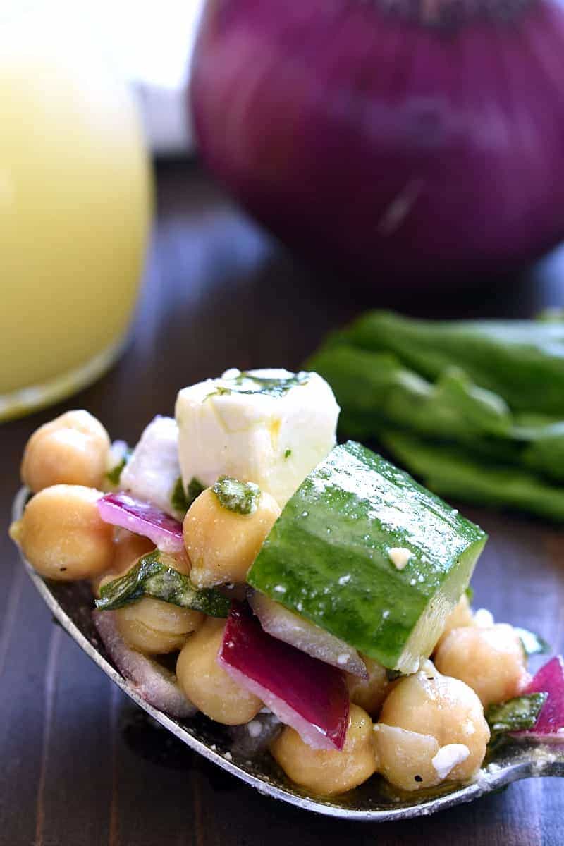 This Chickpea Cucumber Feta Salad has ALL the best flavors! Loaded with chickpeas, cucumbers, red onions, feta cheese, and fresh basil....this salad is so easy to make and is the perfect side dish for any meal!