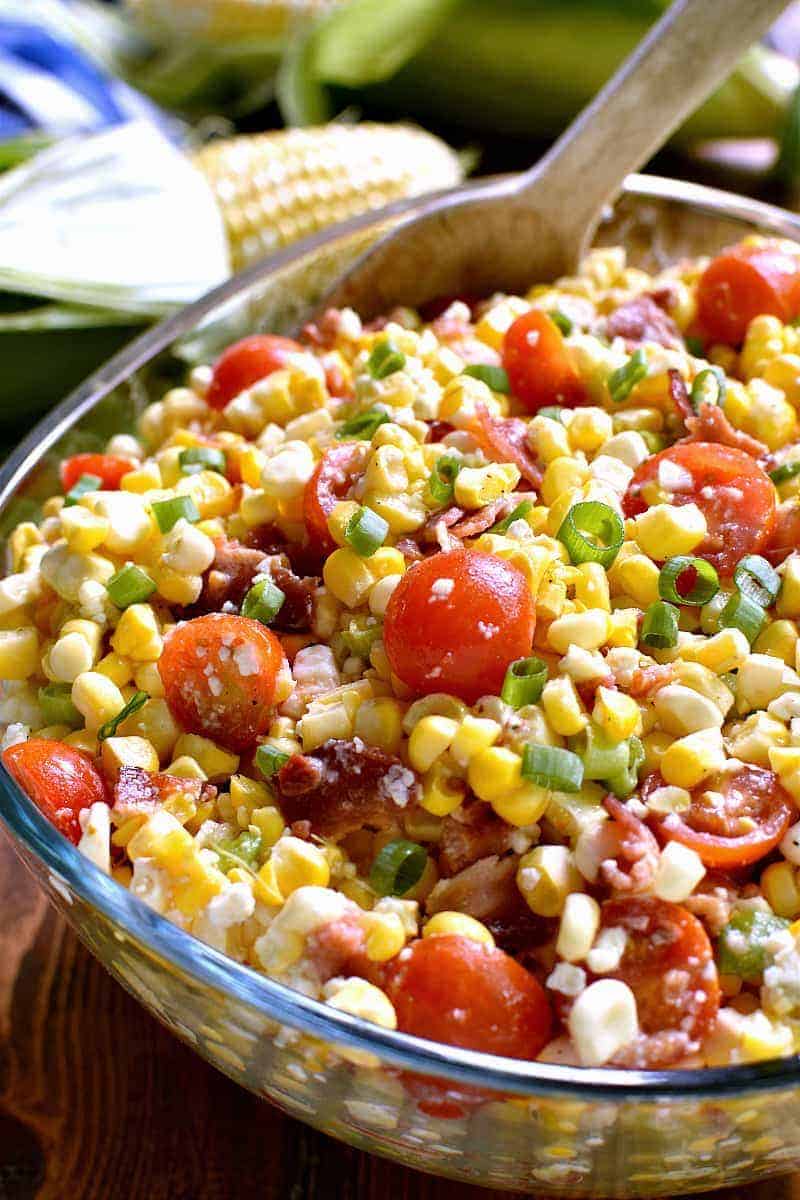 This Bacon Blue Cheese Corn Salad is the most delicious corn salad ever! Fresh sweet corn combined with crispy bacon, cherry tomatoes, crumbled blue cheese, green onions, and a light vinaigrette. Perfect for summer picnics, cookouts, or pot lucks!