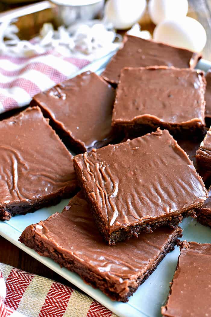 Frosted brownies on plate