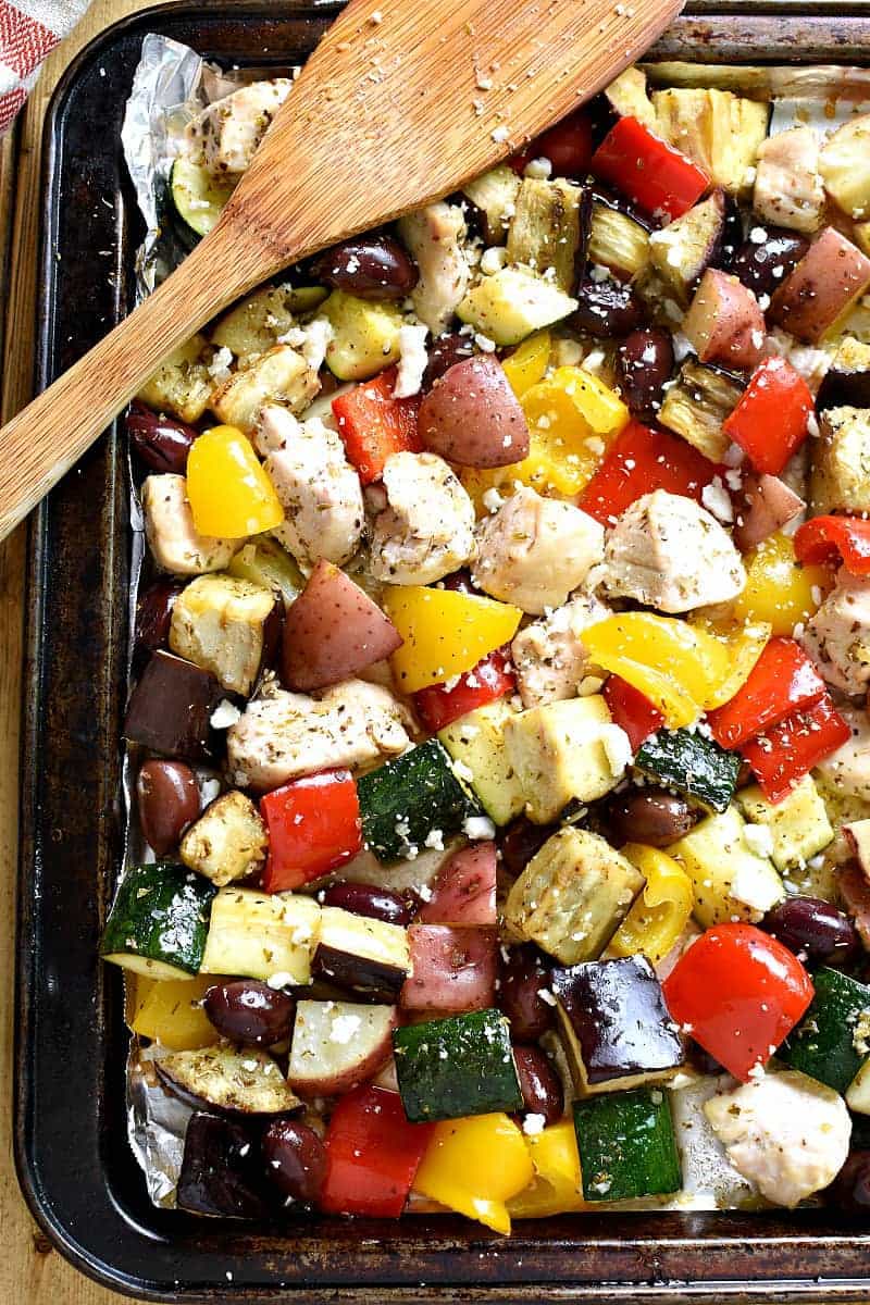 This Sheet Pan Greek Chicken has ALL the best flavors! Loaded with chicken, veggies, kalamata olives, and Greek seasonings, this delicious one pan dinner comes together quickly and feeds a family!