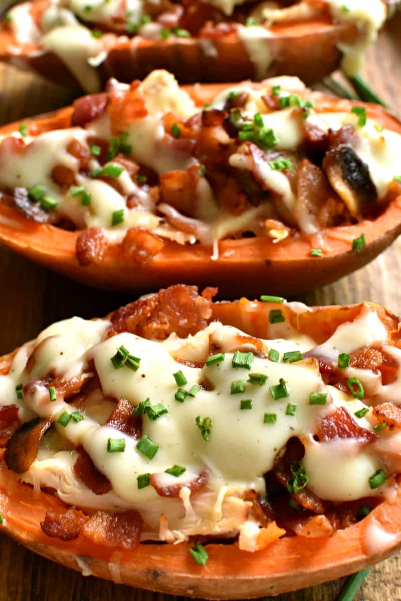 These Loaded Baked Sweet Potatoes make the most delicious dinner! Stuffed with chicken, bacon, mushrooms, swiss cheese, and a creamy cheese sauce, they're easy to make and packed with flavor! Sure to become a new family favorite!