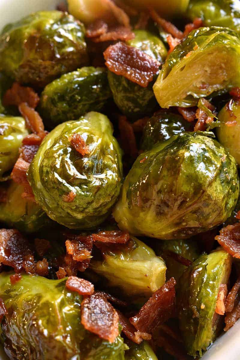 These Maple Bacon Roasted Brussels Sprouts are the ultimate side dish! Fresh brussels sprouts roasted in olive oil, butter, and maple syrup, then tossed with crispy bacon and sprinkled with sea salt. Perfect for dinner anytime and great for the holidays, too!