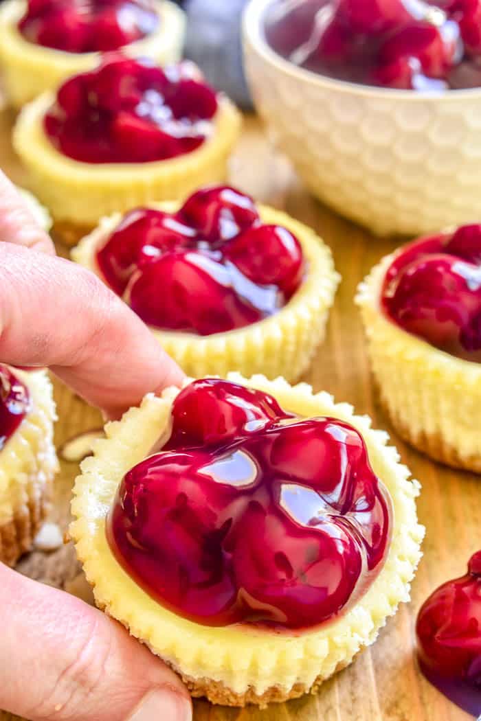 If you love cheesecake, you'll adore these Mini Amaretto Cherry Cheesecakes! The perfect easy dessert for holidays, parties, baby showers, or any special occasion. 