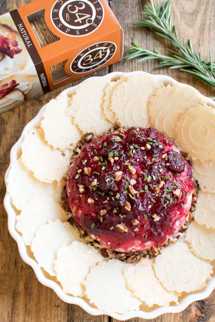 Take cheese & crackers to the next level with this Cranberry Pecan Baked Goat Cheese! Loaded with creamy goat cheese, crisp bacon, chopped pecans, cranberry sauce, and fresh rosemary, this is the ultimate holiday appetizer! The perfect blend of savory and sweet, and the perfect way to elevate your next cocktail party or holiday gathering. Whether you're a seasoned pro or hosting for the first time, this recipe is easy, delicious, and sure to impress. If you love cheese, you'll LOVE this yummy twist on a classic....and so will all your guests!