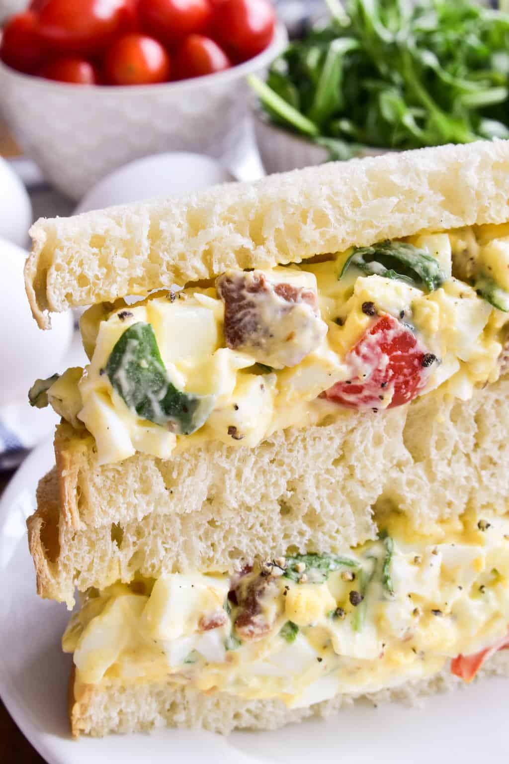 This BLT Egg Salad combines two classics in one delicious dish that's sure to become a new favorite! This egg salad has all the creamy deliciousness you expect from egg salad, plus the bold flavors of bacon, lettuce, and tomato. Perfect for weekday lunches and summer picnics, and a great way to use up leftover Easter eggs. If you love egg salad, you'll LOVE this yummy twist!