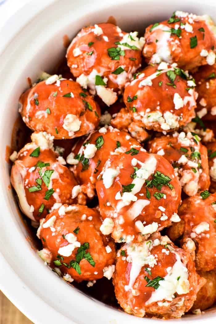 Buffalo Chicken Meatballs...made in the slow cooker! These meatballs are loaded with delicious ingredients and packed with the BEST flavor. They make a great easy appetizer or sandwich, and are perfect for game days, parties, or summer tailgating.