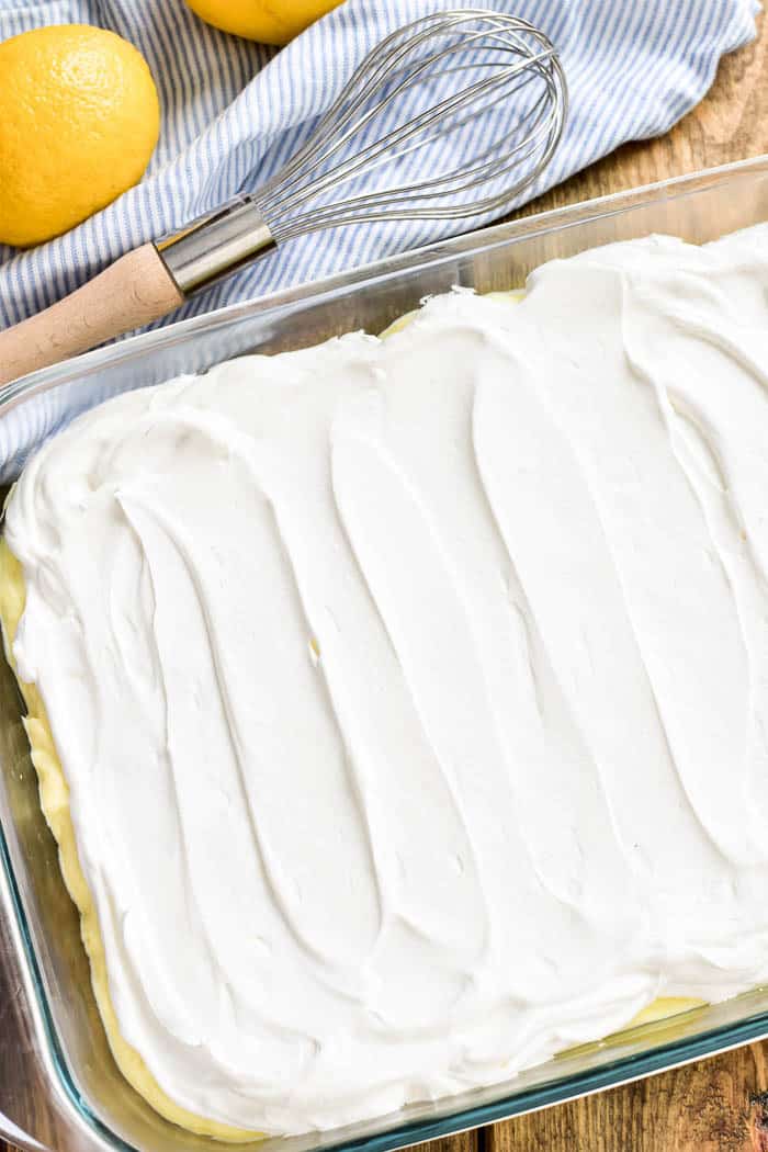Layers of Lemony Love is a deliciously creamy lemon dessert that's perfect for spring! This easy dessert starts with a simple shortbread crust topped with sweet lemon cheesecake and creamy whipped topping. It's ideal for summer parties, picnics, or baby showers....and always a crowd favorite. If you love lemon, this is a must make recipe!
