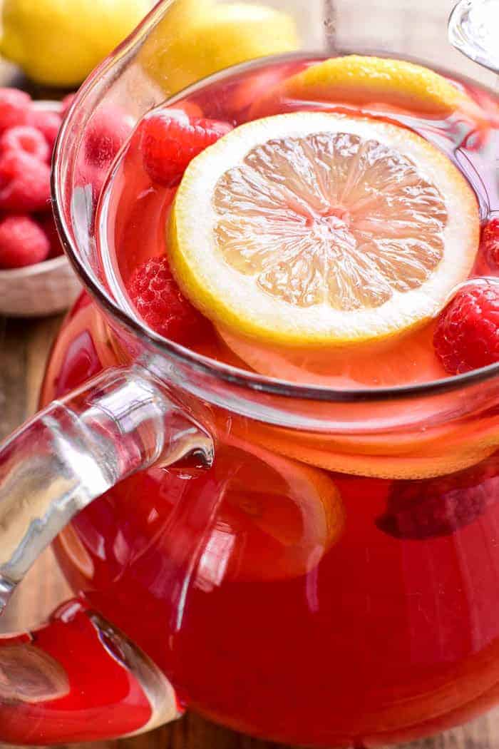 Lemon Raspberry Sangria is the perfect way to welcome in spring! This fruity sangria starts with rose wine and raspberry lemonade and is packed full of fresh raspberries and lemon slices. Ideal for Mother's Day, ladies' nights, or sunny days by the pool. If you love sangria, you'll love this refreshing twist!