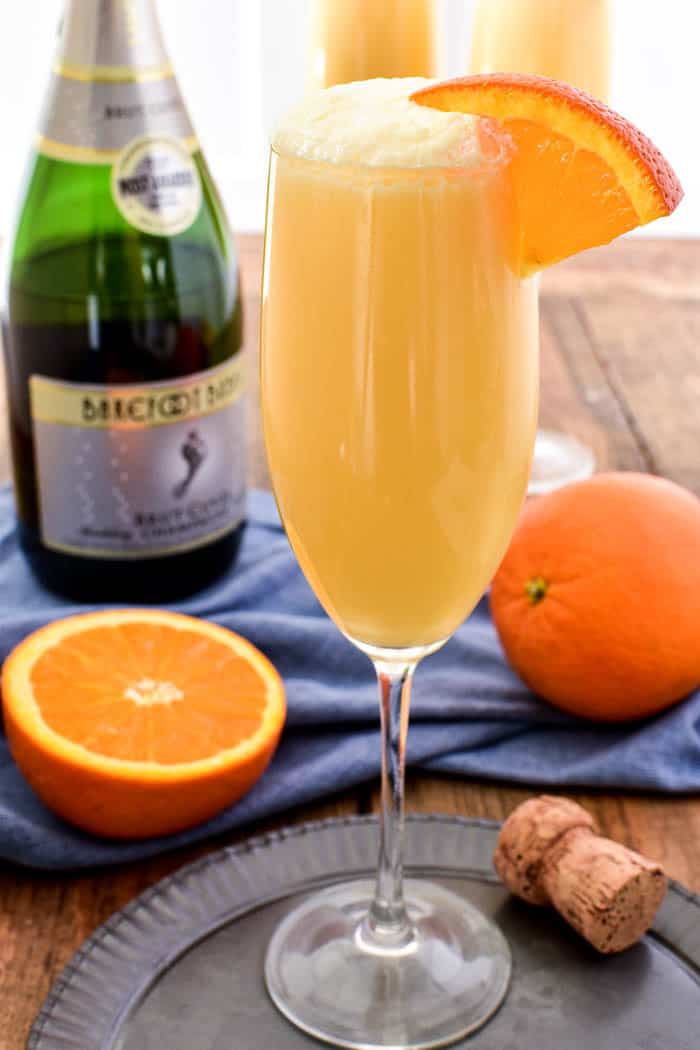 Take your favorite breakfast cocktail to the next level with these delicious Orange Creamsicle Mimosas! They combine the fun of childhood with the deliciousness of adulthood....all in one glass. Made with 4 simple ingredients, these mimosas are just the right blend of creamy, sweet, and bubbly. Perfect for weekend brunches, ladies' nights, or lazy days by the pool. If you love mimosas (and who doesn't!?) you'll love this fun, creamy, YUMMY twist!