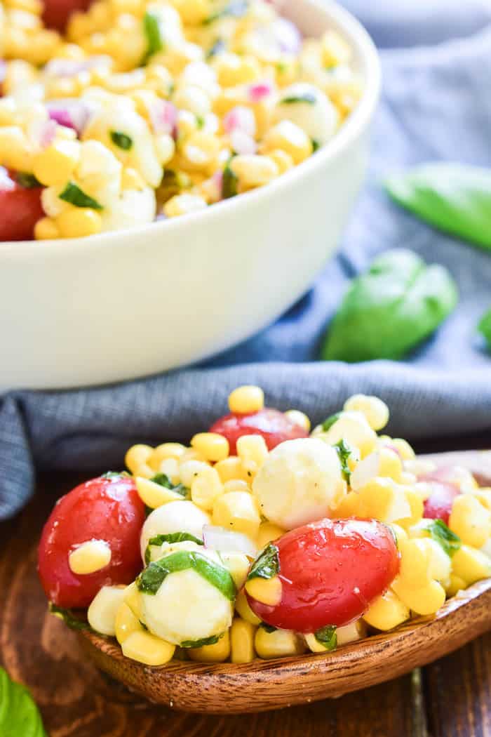 This Caprese Corn Salad combines some of the BEST flavors of summer in one delicious side dish! Fresh sweet corn meets the classic flavor combination of tomatoes, basil, and fresh mozzarella. Dressed in a light vinaigrette, this salad is the perfect side dish for any meal. It can be enjoyed all on its own or topped with grilled chicken or shrimp for a light yet satisfying dish. If you love caprese salad, you'll love this easy, flavorful summer twist!