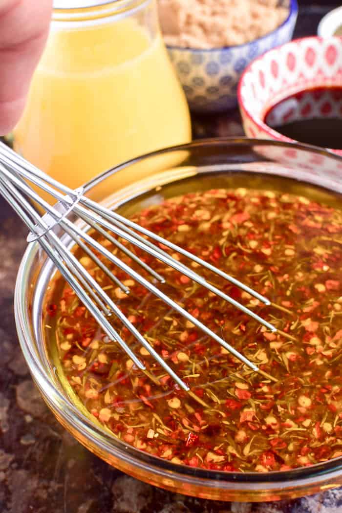 Take your grilling to the next level with this Easy Chicken Marinade! Made with simple, everyday ingredients, this easy marinade comes together in minutes and gives the BEST flavor to grilled chicken. It combines savory and sweet flavors with just a touch of spice for meat that's moist, flavorful, and extremely versatile. If you love grilled chicken, you'll love the difference this marinade makes!