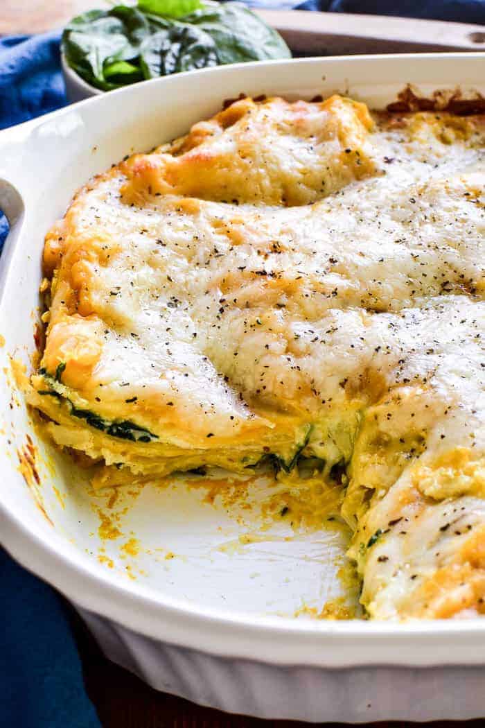 This Butternut Squash Lasagna is the ultimate fall comfort food. It combines layers of creamy ricotta, butternut squash, fresh spinach, and gooey mozzarella in a cheesy lasagna that everyone is sure to love. This dish is easy to make ahead and perfect for busy weeknights or weekend family meals. And it would make a delicious addition to any holiday menu!