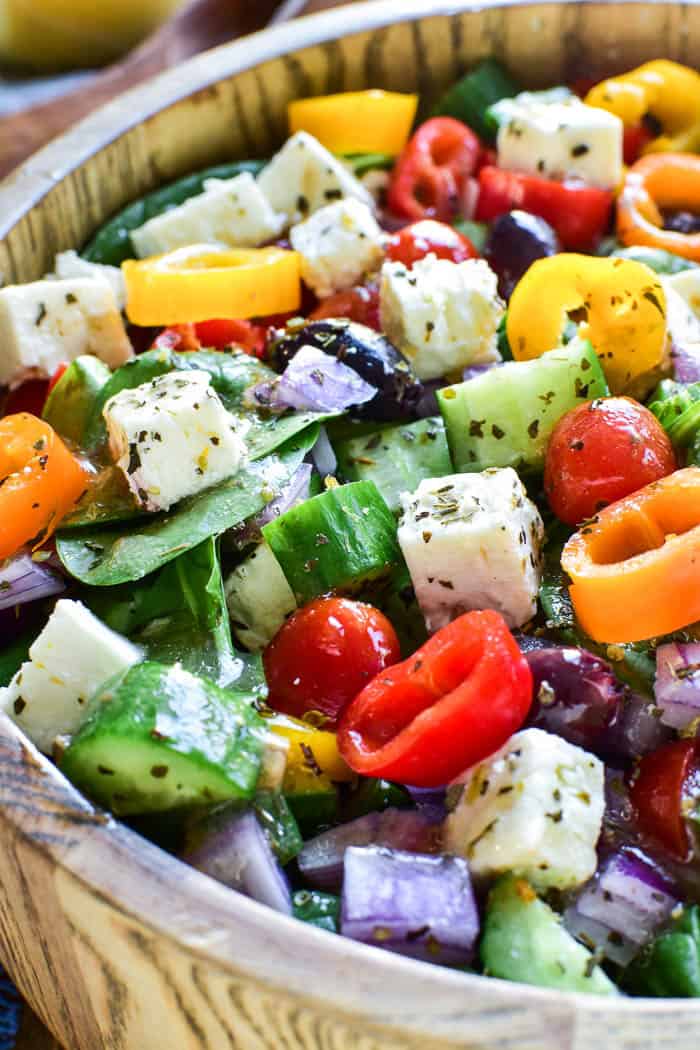 Greek Salad in salad bowl with dressing