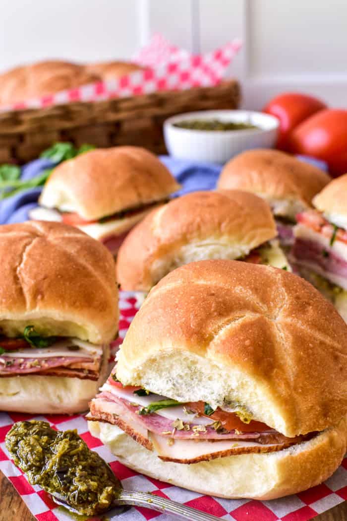 Close up of Italian Sliders with spoonful of pesto