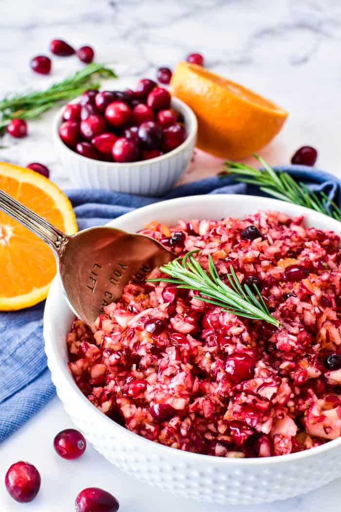 Fresh cranberry relish with serving spoon