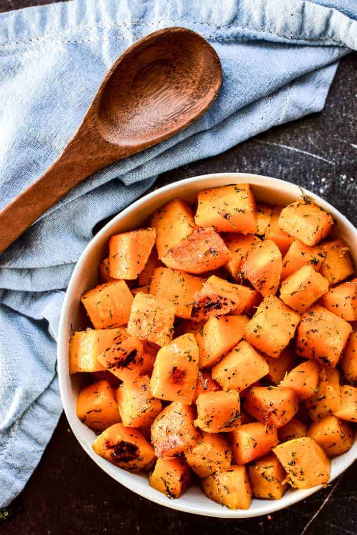 Butternut Squash in serving bowl with wooden spoon