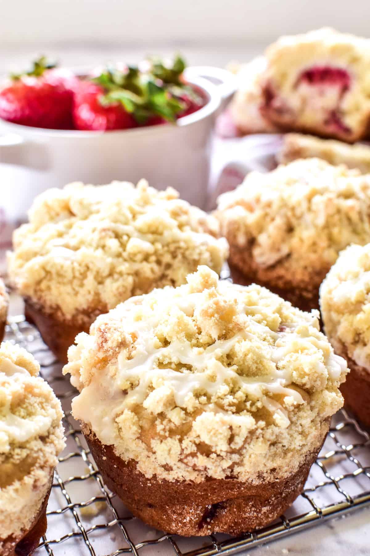Strawberry Muffins with streusel topping on a cooling rack